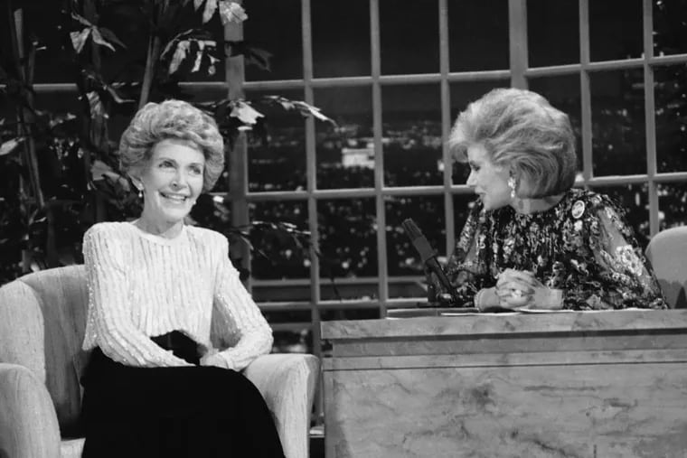 FILE - In this Oct. 30, 1986 file photo, talk show host Joan Rivers, right, talks with guest, first lady Nancy Reagan, during her appearance on "The Late Show Starring Joan Rivers," in Los Angeles. Rivers, the raucous, acid-tongued comedian who crashed the male-dominated realm of late-night talk shows and turned Hollywood red carpets into danger zones for badly dressed celebrities,  died Thursday, Sept. 4, 2014. She was 81. Rivers was hospitalized Aug. 28, after going into cardiac arrest at a doctor's office. (AP Photo, Reed Saxon, File)