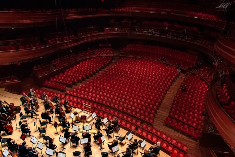 With house lights and seats empty, the Philadelphia Orchestra minutes before their concert at the Kimmel Center on Mar. 12.