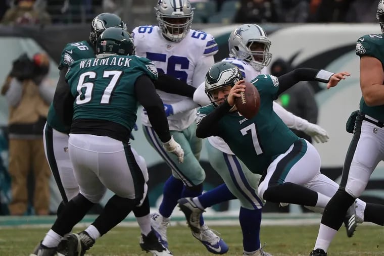 Philadelphia Eagles quarterback Nate Sudfeld slips as he tries to run during the second quarter against the Dallas Cowboys.
