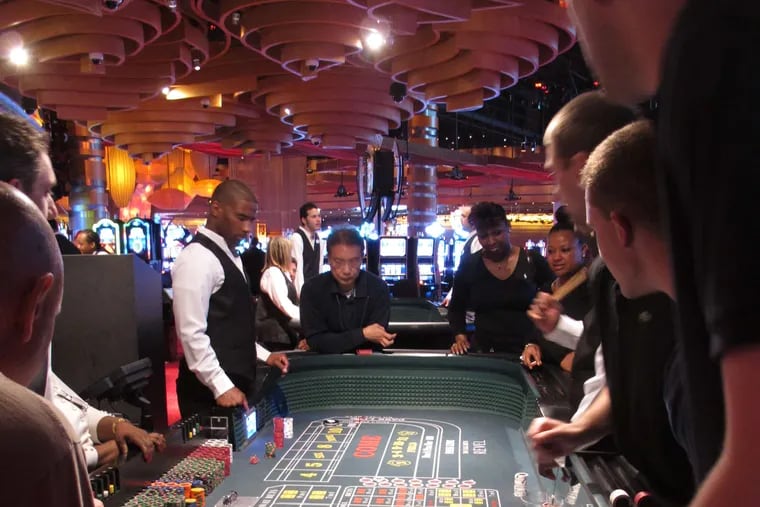 Gambling such as this craps game in Atlantic City would be joined by similar action in North Jersey under legislative proposals.