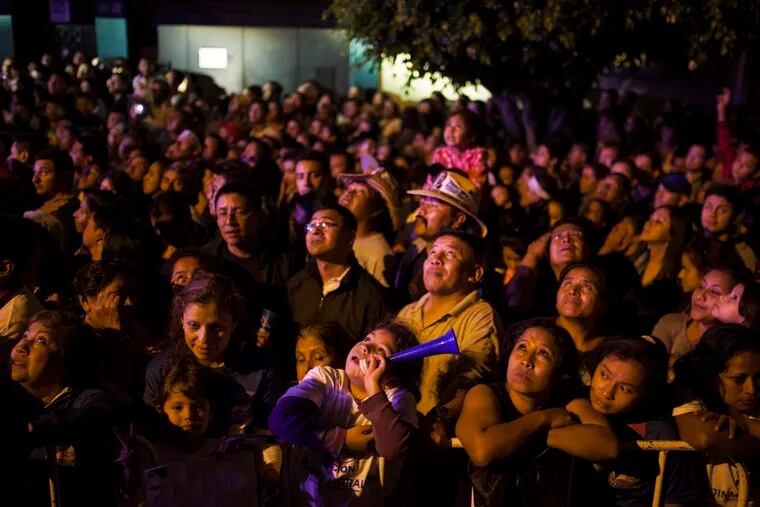 Supporters watch as Jimmy Morales delivers a speech after winning the presidential runoff election in Guatemala. Morales' party, the National Convergence Front, won few seats in Congress.