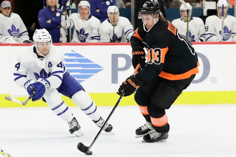 Flyers center Kevin Hayes skates with the puck against Toronto defenseman Morgan Rielly. Hayes has no points and a minus- 8 rating in his last 10 games.