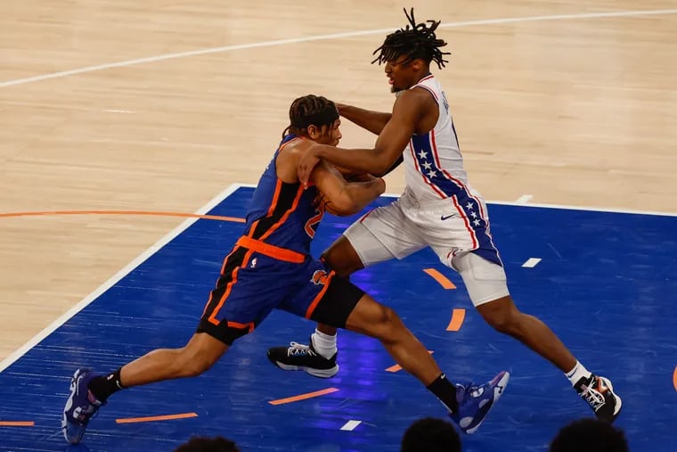 Sixers Tyrese Maxey fouls Knicks Miles McBride during the second quarter of Game 5 in New York, Tuesday, April 30, 2024.