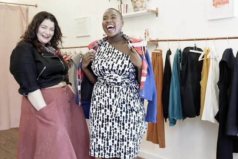 Designer Mary Alice Duff (left) with Melonee Rembert who is modeling The Grace Dress with The Joan Moto Jacket at Alice Alexander, a new made to order plus size boutique, in East Falls on October 19, 2018. ELIZABETH ROBERTSON / Staff Photographer