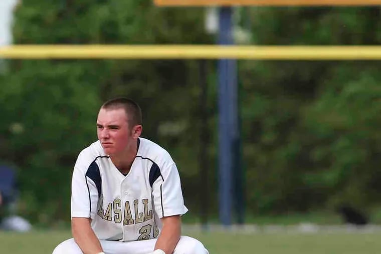 Colin Pyne takes a breather after hitting a double in the second inning of La Salle's playoff victory.