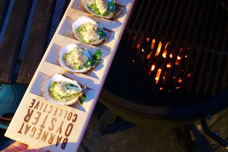 Sugar Shack oysters from the Barnegat Oyster Collective are topped with garlicky ramp butter and ready to be grilled.
