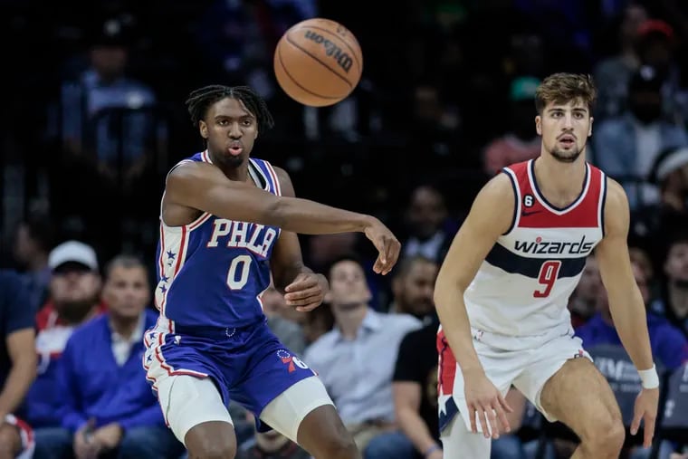 The Sixers' Tyrese Maxey throws a pass in a game against the Wizards. He will gain more responsibility in James Harden's absence.