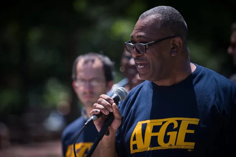 Gary Morton, President of AFGE Local 3631, speaks to demonstrators at a rally at Independence Mall to protest budget cuts proposed by the Trump administration.