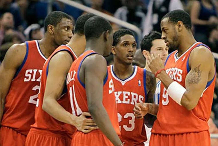 The Sixers seem to be pleased with their current group of players. (John Raoux/AP file photo)