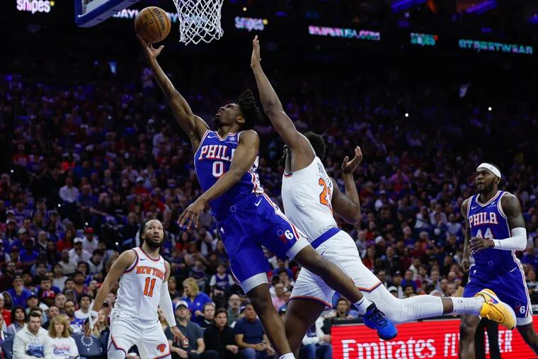 Sixers Tyrese Maxey lays up the ball against Knicks Mitchell Robinson during the first quarter of Game 6 in an NBA basketball first-round playoff series, Thursday, May 2, 2024, in Philadelphia.