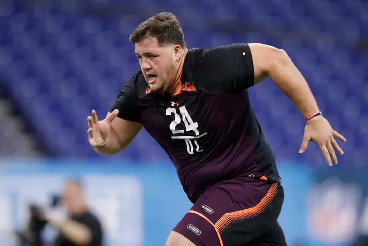 Offensive lineman Nate Herbig runs a drill at the NFL scouting combine in Indianapolis back on March 1. His 40-yard-dash was the slowest recorded, but he has been quick to learn to play center with the Eagles.