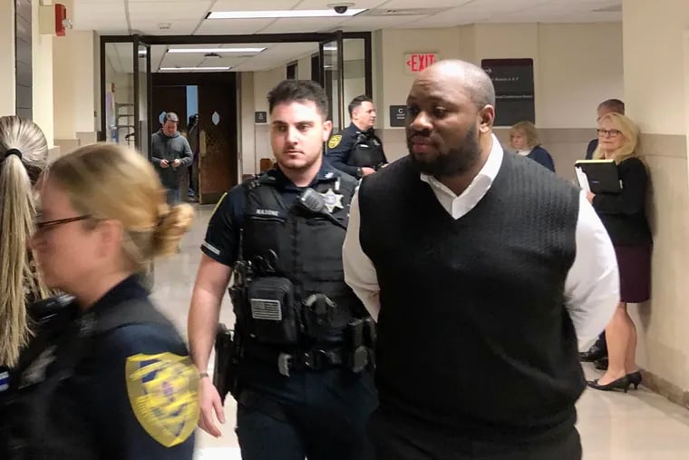 Blair Watts is escorted out of a courtroom Tuesday in the Montgomery County Courthouse. Watts' trial on first- and third-degree murder ended Tuesday, with attorneys offering conflicting theories of the case in their closing arguments.