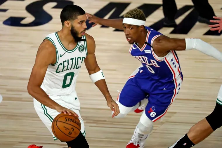 Celtics forward Jayson Tatum dribbling around 76ers guard Josh Richardson during the second half of Game 3 last month.