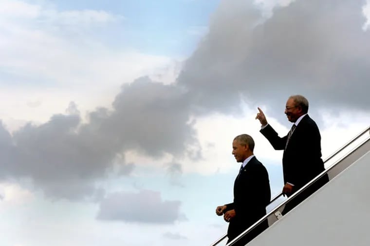 President Barack Obama arrives with Congressman Chaka Fattah (right) at Philadelphia International Airport July 14, 2015. (TOM GRALISH / Staff Photographer)
