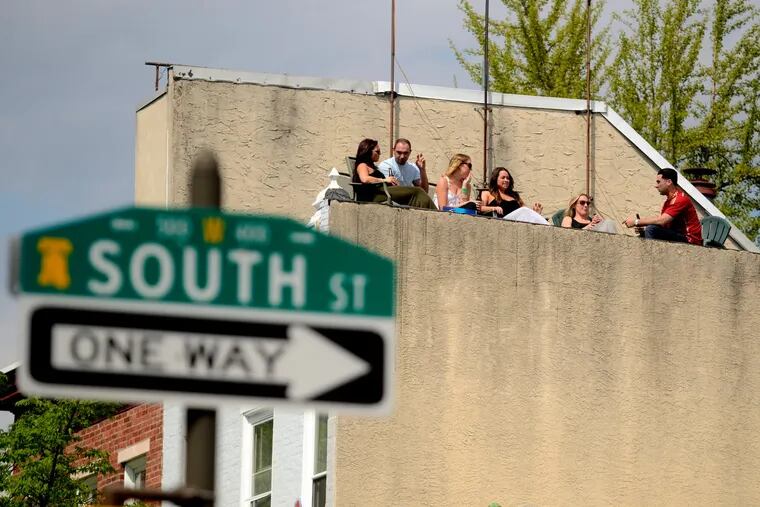A rooftop view down onto the South Street Spring Festival. TOM GRALISH / Staff Photographer