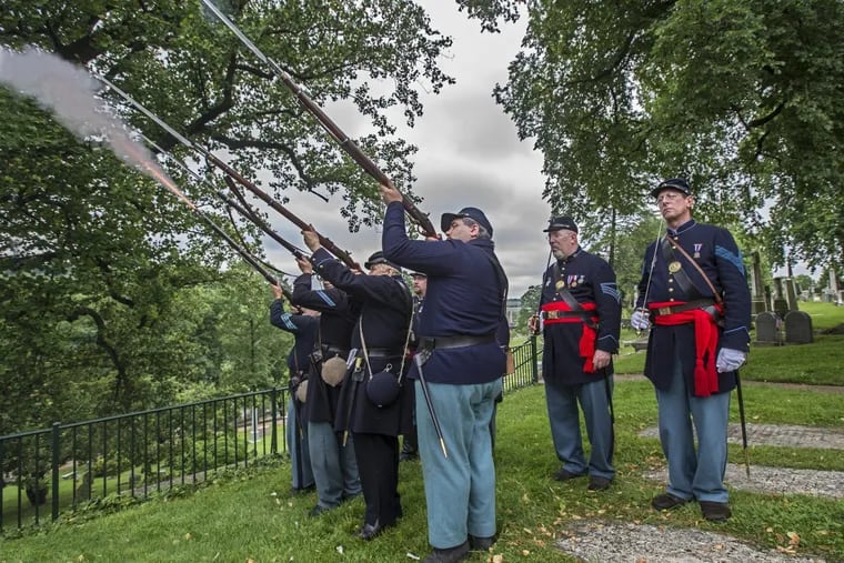 Union soldiers of the 28th Pennsylvania let loose a volley as a show of respect at the grave of Gen. George Meade on Sunday during the celebration of the traditional Decoration Day hosted by the Grand Army Meade Post #1 at Laurel Hill cemetery.