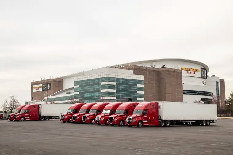 The Dan + Shay fleet of semi-trailers,  which transports the bands equipment and sets, in the Wells Fargo Center’s parking lot on March 13, 2020.  The concert was postponed due to COVID.