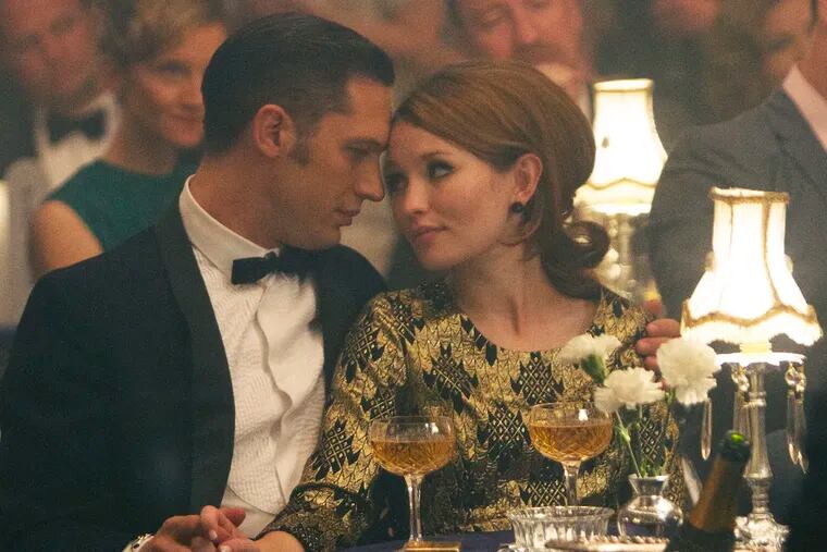 Tom Hardy stars Reggie Kray (left) and his twin Ronnie in "Legend," story of the rise and fall of London's most notorious gangsters. Emily Browning plays Frances Shea.