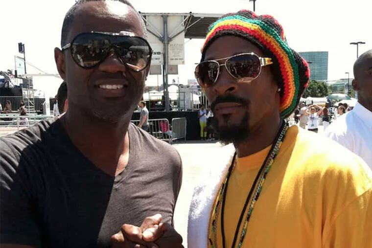 Snoop Lion (nee Dogg) look-alike Lawrence Johnson (right) fooled singer Brian McKnight at the BET Awards last month.