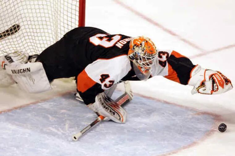Flyers goaltender Martin Biron makes one of his 29 saves last night against the Florida Panthers.