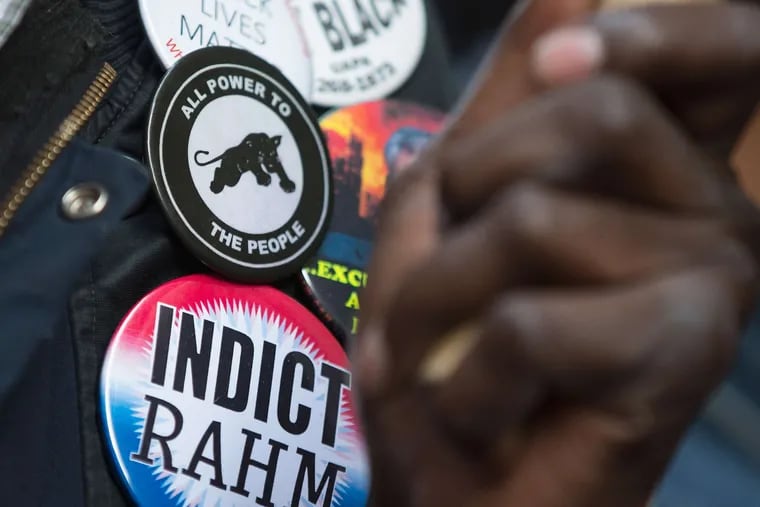 Buttons carry the Chicago protest message. Some activists wore T-shirts that read &quot;Rahm Failed Us.&quot;