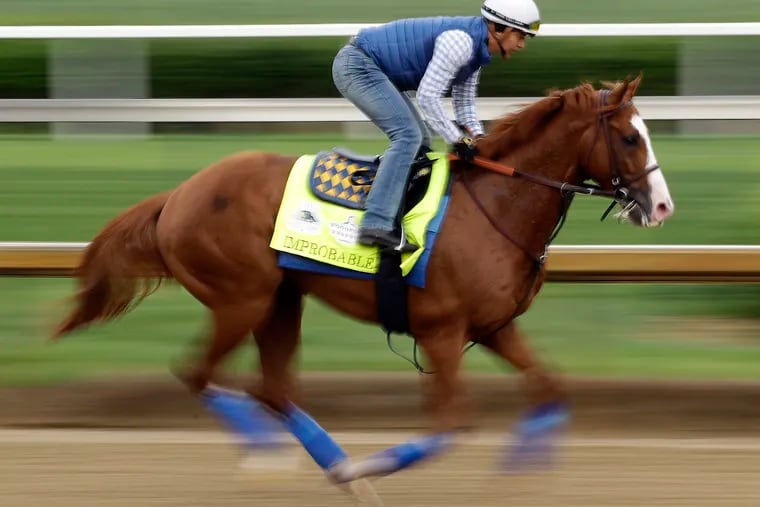 Improbable runs during a workout at Churchill Downs in May 2019.