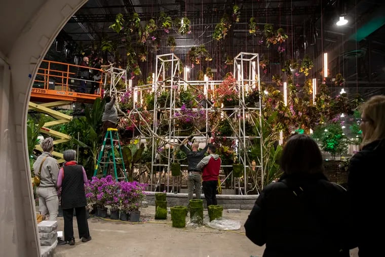 Hanging floral arrangements decorate the entranceway at the PHS Philadelphia Flower Show at the Pennsylvania Convention Center on Monday. The Flower Show opens on March 4 and runs through March 12.