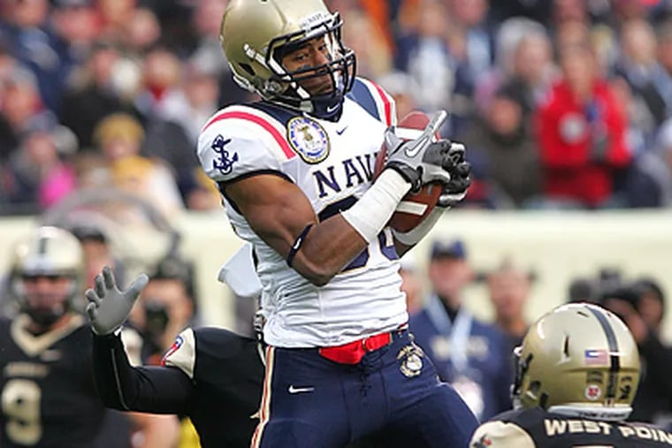Navy's Brandon Turner goes up for a catch against Army. (David Swanson / Staff Photographer)