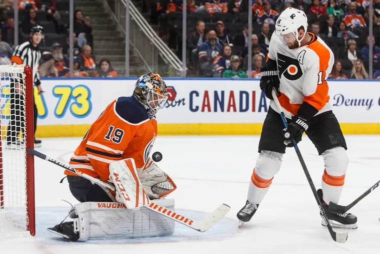 Flyers center Sean Couturier fires one of his eight shots at Edmonton goalie Mikko Koskinen on Wednesday. Koskinen made 49 saves, including all eight of Couturier's shots and nine by James van Riemsdyk.