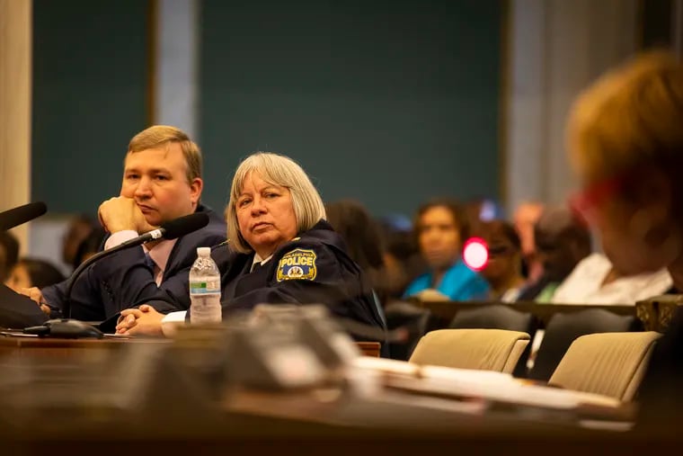 Christine M. Coulter listens as City Councilwoman Cindy Bass speaks in front of the City Council committee and community at the hearing on Tuesday, Sept. 10, 2019.