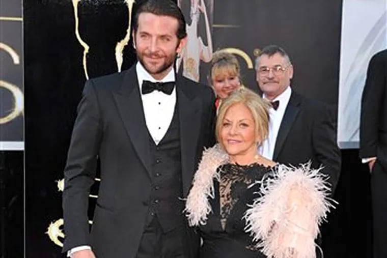 Bradley Cooper and his date, mom Gloria Campano, are a frequent duo on red carpets, including in 2013 when this photo was snapped. On Sunday, Feb. 12, 2023, the pair appeared in a Super Bowl commercial for telecommunications giant T-Mobile.