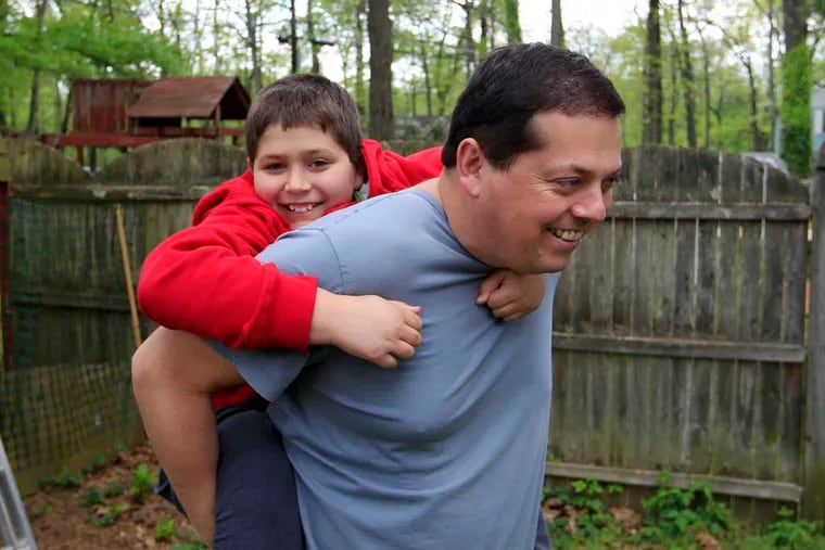 Stuart Chaifetz with his autistic son, Akian. A new study holds out the possibility of diagnosing autism before symptoms appear.