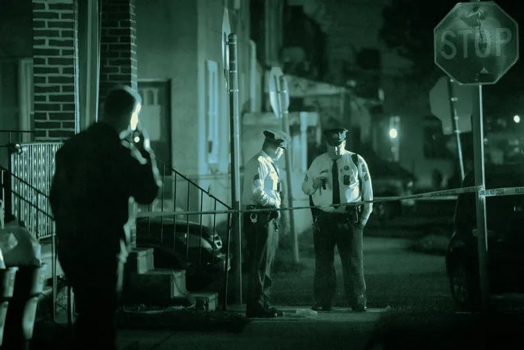 Philadelphia police investigate a shooting scene.