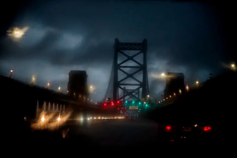 A fast-moving storm crosses over the Ben Franklin Bridge from Philadelphia to New Jersey on Wednesday, May 29, 2019.