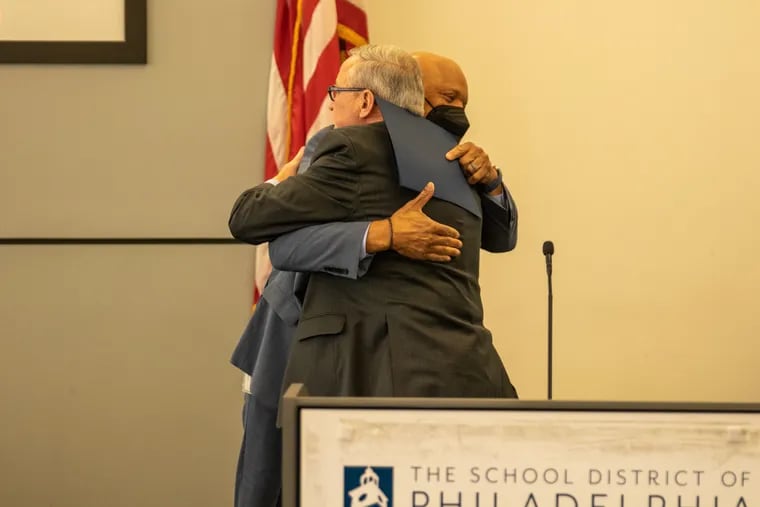 Mayor Jim Kenney embraces Superintendent William R. Hite Jr. at Hite's last meeting Thursday as Philadelphia's schools chief. "I just want to tell you personally that I just find you to be one of the most dedicated, best public servants I've ever worked with in 30-plus years," Kenney said.