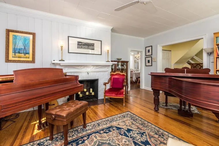 The four-bedroom, 1½-bath house has original detailed millwork and trim and high ceilings on the first floor.