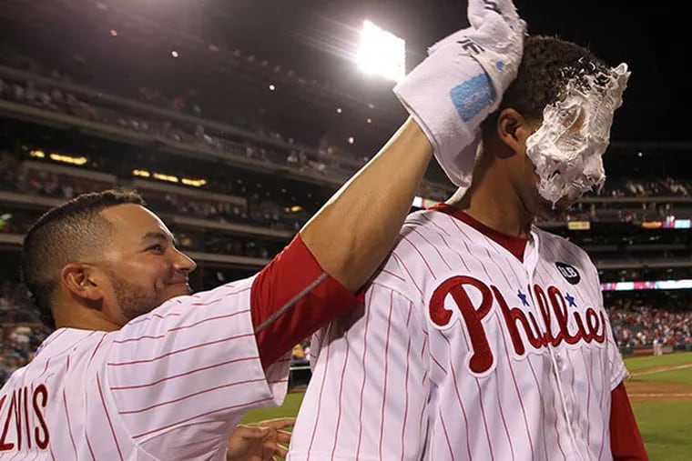 Phillies' Aaron Altherr gets a towel full of shaving cream  from teammate Freddy Galvis.