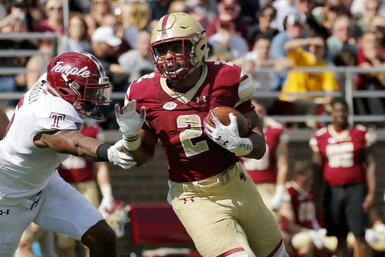 Boston College running back AJ Dillon (2) rushes with the ball ahead of Temple linebacker Shaun Bradley (5) during the first half of an NCAA college football game, Saturday, Sept. 29, 2018, in Boston. (AP Photo/Mary Schwalm)