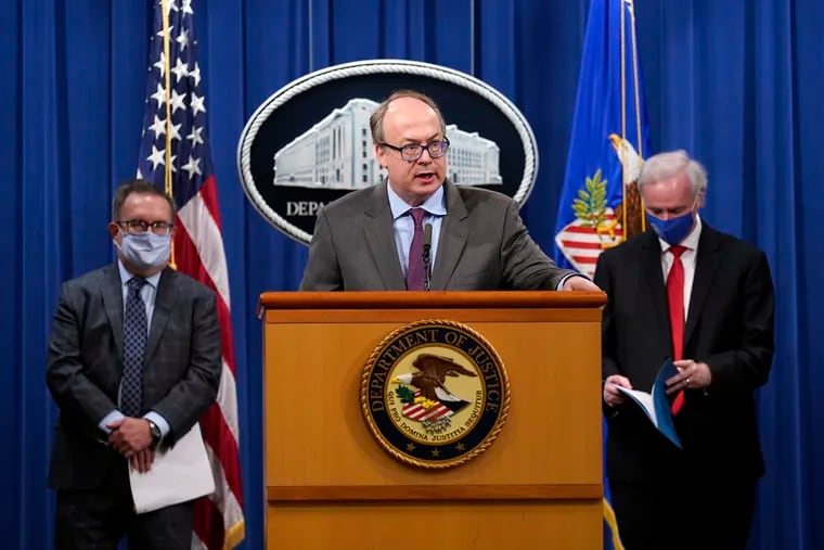 Jeffrey Clark, assistant attorney general for the environment and natural resources division, speaks during a news conference, flanked by Environmental Protection Agency Administrator Andrew Wheeler, left, and Deputy Attorney General Jeffrey Rosen, right, in September 2020.