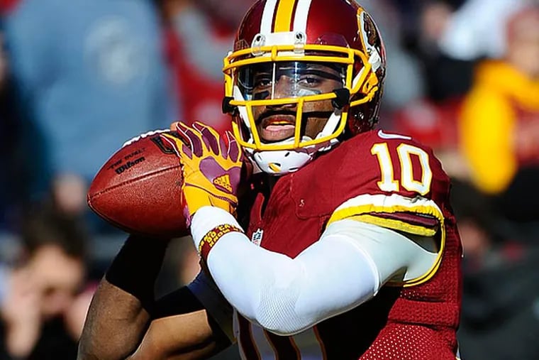 Redskins quarterback Robert Griffin III is expected to start against Eagles. (Brad Mills/USA Today)