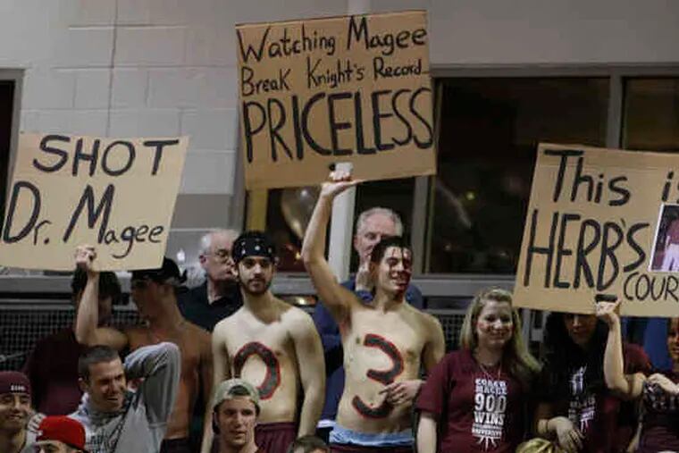 Fans show their support for Philadelphia University coach Herb Magee during last night's game.