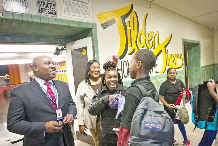 Tilden Middle School principal Brian Johnson socializing with students as they make their way into school Thursday morning. ( ALEJANDRO A. ALVAREZ / STAFF PHOTOGRAPHER )