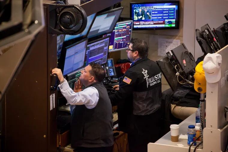 Traders work on the floor of the New York Stock Exchange (NYSE) in New York on Tuesday.