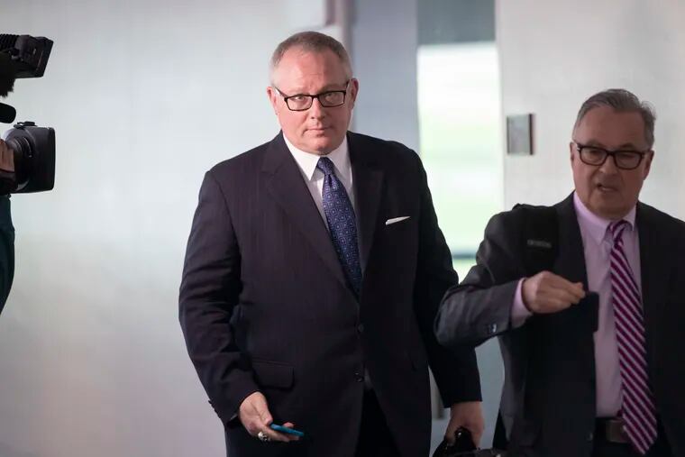 Forrmer Trump administration official Michael Caputo, center, shown in May 2018.