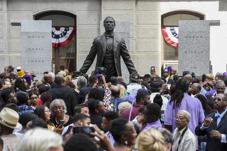 People who attended the dedication of the Octavious Catto Memorial mill around the statue of Catto on the southwest corner of City Hall after the ceremony September 26, 2017. The statue is the first of an African American hero on city property.