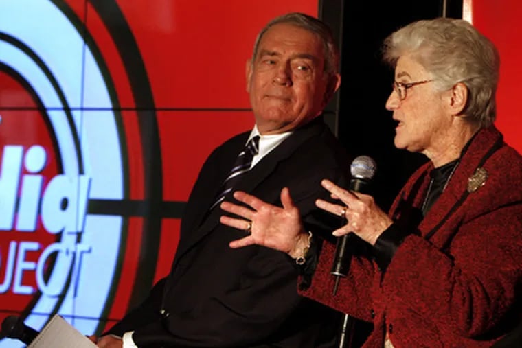 Dan Rather (far left) listens as District Attorney Lynne Abraham speaks at panel discussion yesterday.