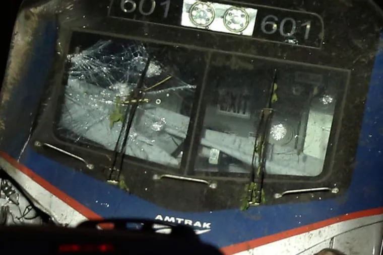 The front of the Amtrak engine showed windshield damage Tuesday night, much of it coming from the derailment. The FBI has been asked to examine the damage. (ELIZABETH ROBERTSON / Staff Photographer)