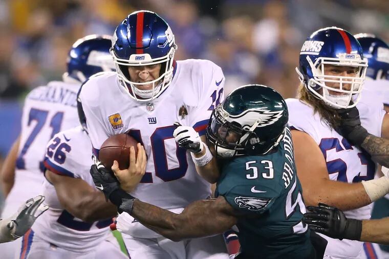Nigel Bradham (53) sacks Giants quarterback Eli Manning during the Eagles' win on Thursday.
