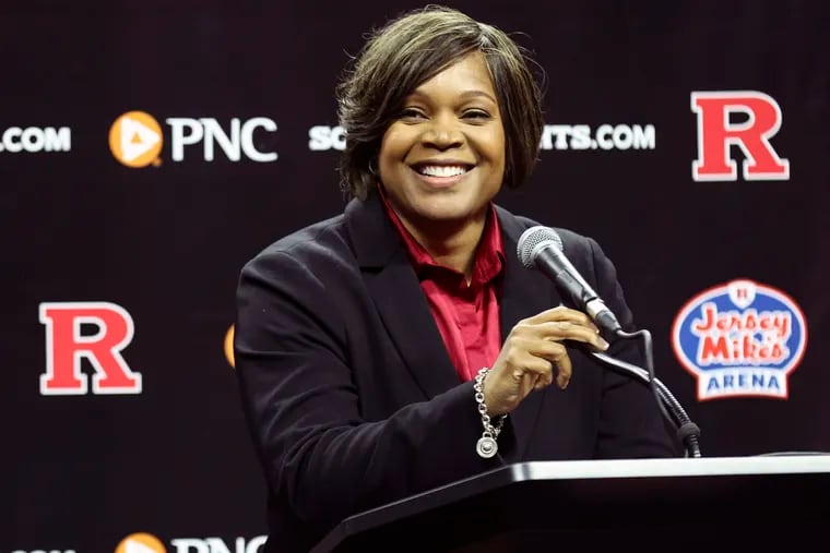 Rutgers women's basketball coach Coquese Washington smiles during her introductory news conference.