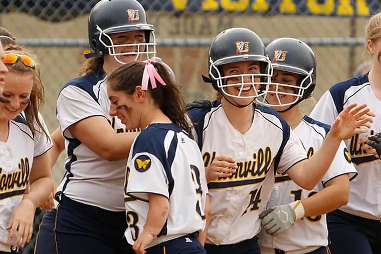 Unionville gathers around Madi Ross after her solo HR. West Chester
Henderson at Unionville in softball on Friday, May 9, 2014. ( RON
CORTES / Staff Photographer ).